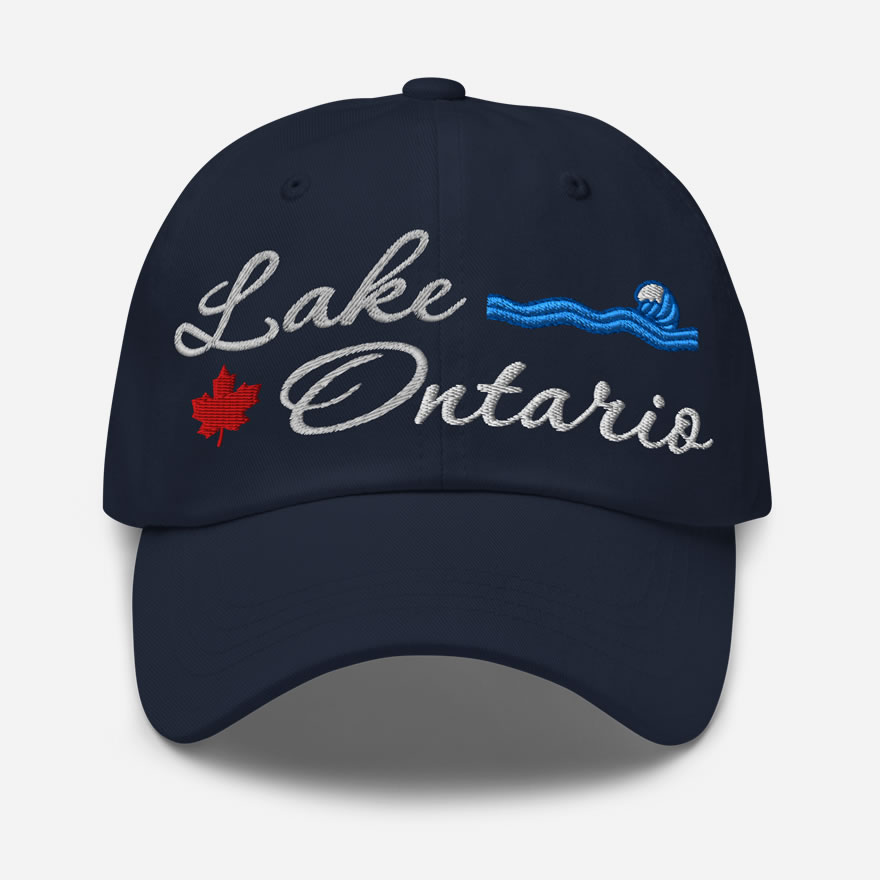 Front of Lake Ontario navy classic dad hat showing 'Lake Ontario' embroidered white along with red maple leaf & blue wave.