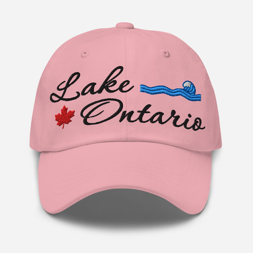 Front of Lake Ontario pink classic dad hat showing 'Lake Ontario' embroidered black along with red maple leaf & blue wave.
