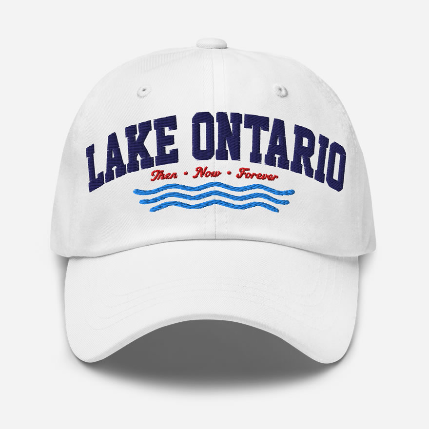 Front of Lake Ontario Canada white dad hat showing words 'Lake Ontario' atop wavy lines embroidered navy above red maple leaves.
