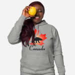 Front of Canada Polar Bear carbon grey unisex premium hoodie on female with maple leaf & Polar Bear print. Canada written below.