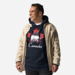 Front of Canada Polar Bear navy blazer unisex premium hoodie on male with maple leaf & Polar Bear print. Canada written below.
