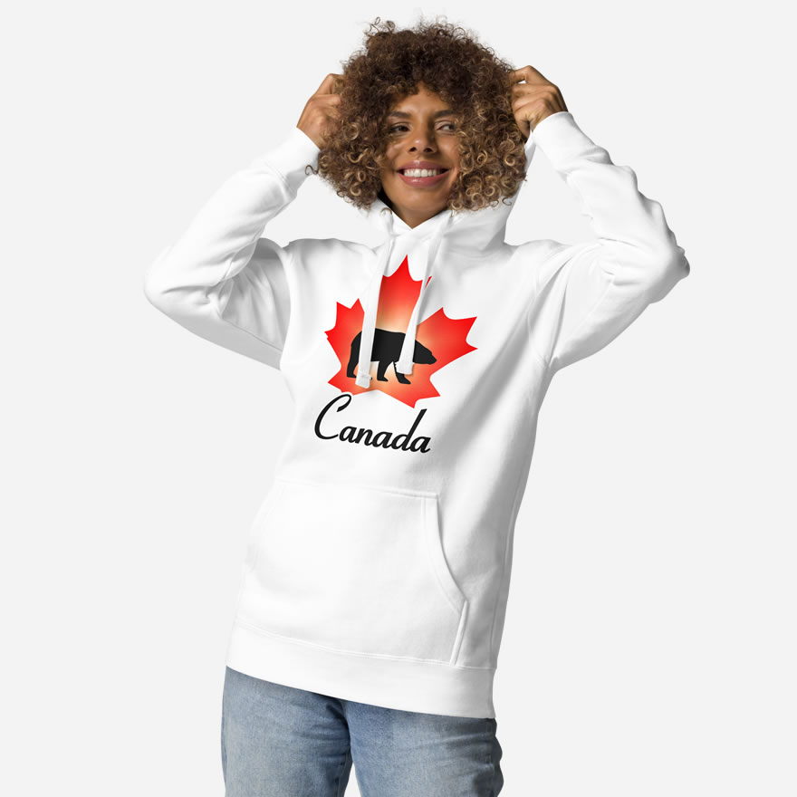 Front of Canada Polar Bear white unisex premium hoodie on female with maple leaf & Polar Bear print. Canada written below.